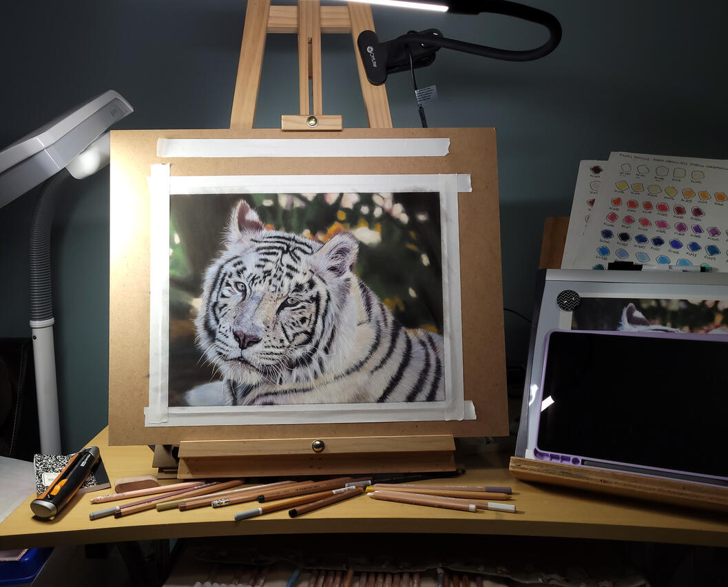 Tiger painting on easel. Tiger painting on easel.